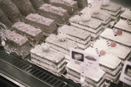 Board with delicious cake on tableの写真素材