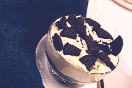 Board with delicious cake on tableの写真素材