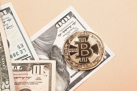 Turkish lira banknotes, US Dollars and bitcoin coin