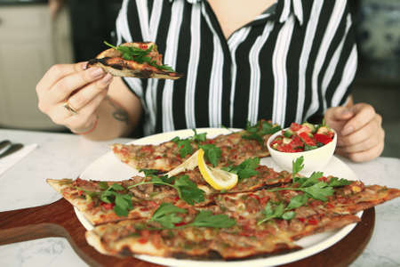 Traditional turkish baked dish pide. Turkish pizza pide, Middle eastern appetizers. Turkish cuisine. Pita with meat fillingの写真素材