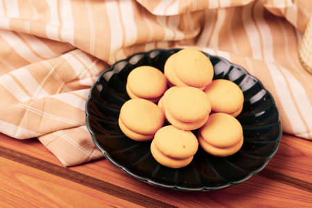 Assorted selection of tea biscuits and chocolate chip cookiesの写真素材