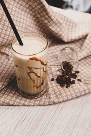 Iced coffee with milk. Iced coffee latte. Woman holding glass cup of iced coffee.の写真素材