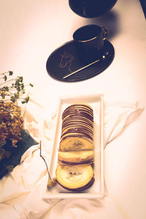 A slice of delicious cake and a cup of coffeeの写真素材