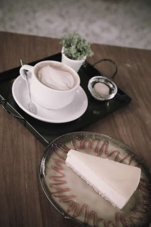 A slice of delicious cake and a cup of coffeeの写真素材