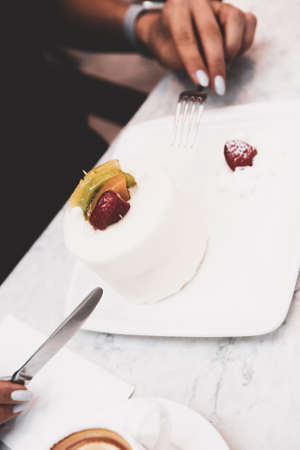 A slice of delicious cake and a cup of coffeeの写真素材