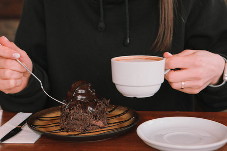A slice of delicious cake and a cup of coffee