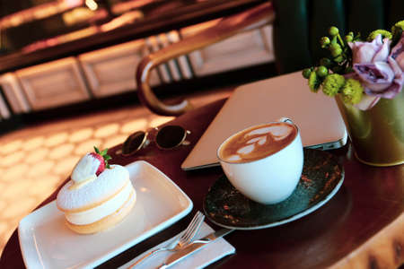 A slice of delicious cake and a cup of coffeeの写真素材