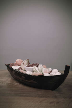 Plate with delicious mixed fruits and sliced fruitsの写真素材