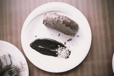 Board with delicious cake on tableの写真素材