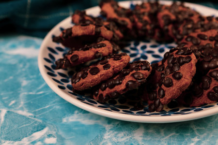 Assorted selection of tea biscuits and chocolate chip cookiesの写真素材