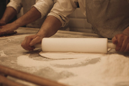 Making a turkish pizza or lahmacun - fast food and popular street food in Mediterranean countries.