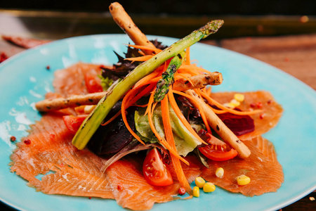 Cooked salmon with some vegetablesの写真素材