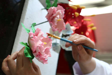 Board with delicious cake on tableの写真素材