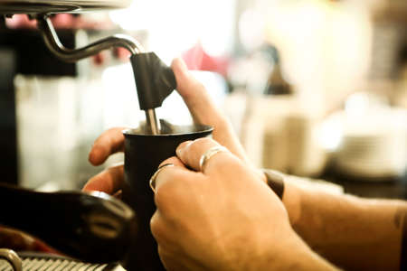 barista brewing coffee in the coffee roomの写真素材