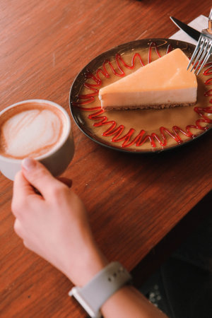 A slice of delicious cake and a cup of coffeeの写真素材