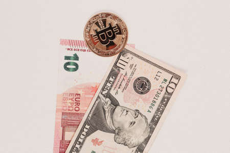 Euro, US Dollars and bitcoin coinの写真素材
