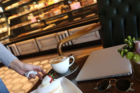 A slice of delicious cake and a cup of coffeeの写真素材