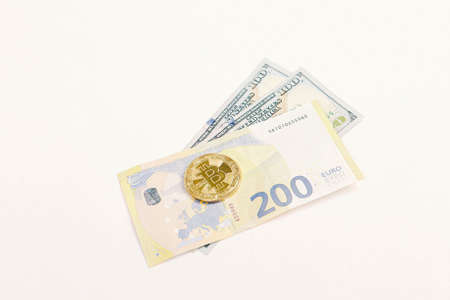 Euro, US Dollars and bitcoin coinの写真素材