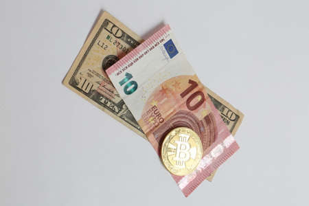 Euro, US Dollars and bitcoin coinの写真素材