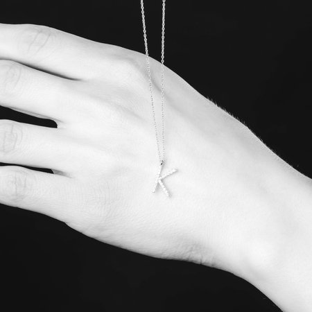 Pendant on a woman's hand. Black and white photo.の写真素材