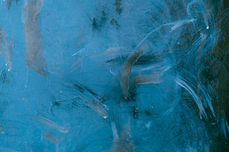 Blue abstract background. Texture of blue paint on a metal surface.
