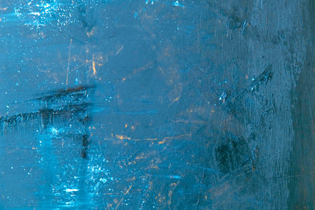 Blue abstract background. Texture of a blue wall with scratches and cracks