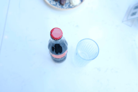 bottle of cola on the table, shallow depth of fieldの写真素材