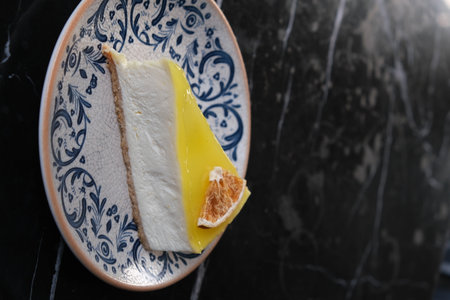 Close up of a slice of lemon cake on a plate, selective focusの写真素材