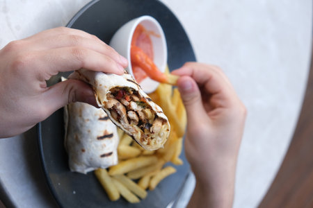 Turkish and Arabic Traditional Ramadan Kebab. Ramadan Kebab is a sandwich which is wrapped in a lavash.の写真素材