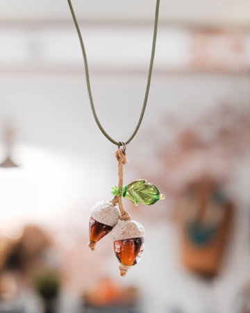 Close up of ornaments hanging on a string.