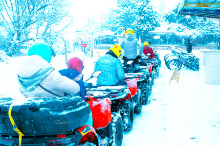 Unidentified tourists are driving quad bikes.