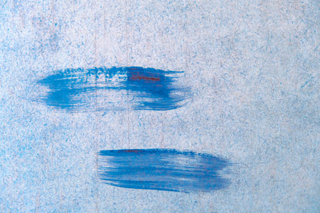 Blue paint on a paper background. Blue paint on a paper.の写真素材