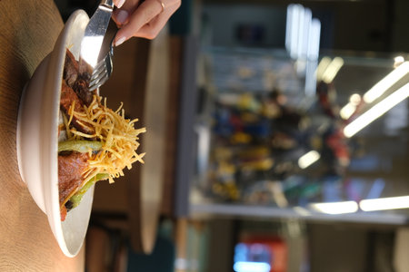 Woman eating food in cafe, closeup. Food delivery serviceの写真素材