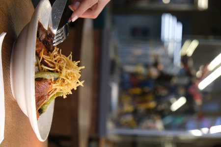 Close up of a woman eating hamburgerの写真素材