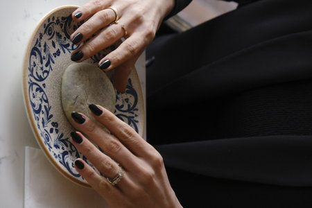 Female hands with black manicure and blue nail design. Manicure on nails.の写真素材