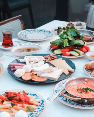 Traditional Turkish and Greek dinner appetizer table with meat, olives, cheese, olives and saladの写真素材