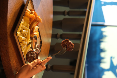 Woman eating ice cream in cafe, closeup.の写真素材