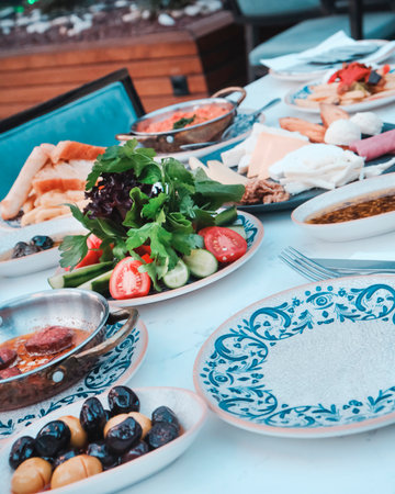 Traditional Turkish and Greek dinner appetizer table with meat and vegetablesの写真素材