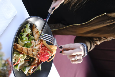 Closeup of a woman eating salad. Healthy food concept.の写真素材