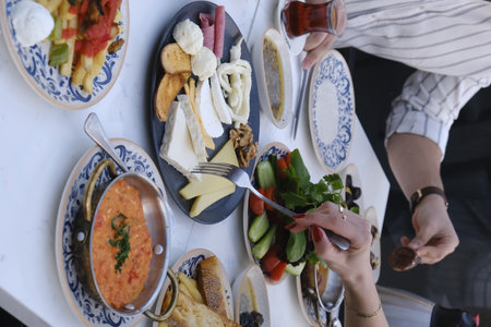 Traditional Turkish and Greek dinner appetizer table with meat, vegetables and cheeseの写真素材