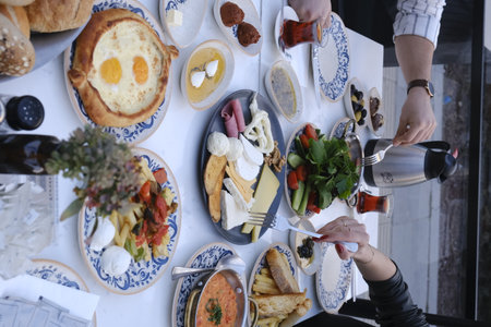 Rich and delicious breakfast on the table in the hotel restaurant. Food styling and restaurant meal serving.の写真素材