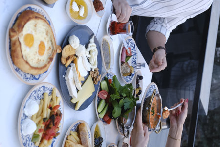 Top view of a group of people having a breakfast at a restaurantの写真素材