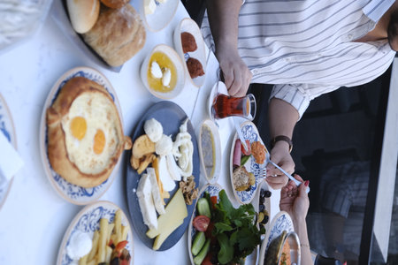 Top view of people eating breakfast in the restaurant. Food and drink concept.の写真素材