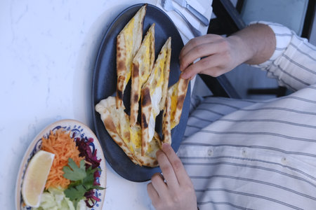 Traditional turkish baked dish pita. Turkish pizza pita, Middle eastern appetizers. Turkish cuisine. Pita with meat fillingの写真素材