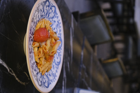 Close up of a plate of pasta with tomato sauce, selective focusの写真素材