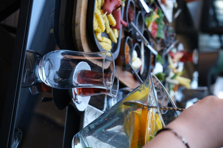 Close up shot of a bar counter with a glass of wine.の写真素材