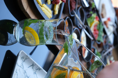 Detail of a glass of lemonade on a bar counter.の写真素材