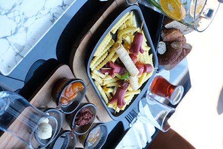 Tray with tasty food on table in restaurant, top view.の写真素材
