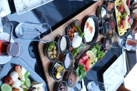 Tray with different kinds of appetizers on table, closeupの写真素材