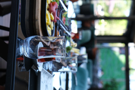 Close up of a bar counter with a glass of wine in a restaurantの写真素材